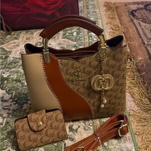 Elegant Brown and Tan Handbag with Gold Accents